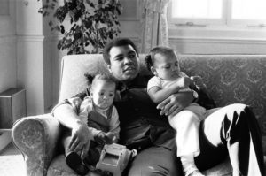 Muhammad Ali cuddling his daughters Laila, (L)and Hana at a hotel in London, December 1978. Action Images/MSI
