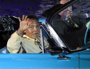 Muhammad Ali waves to the crowd during the opening ceremony of the World Equestrian Games in Lexington, Kentucky, September 2010. REUTERS/John Sommers II
