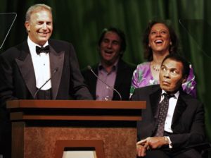 Muhammad Ali, along with his wife Lonnie, react to a story told by actor Kevin Costner at the Muhammad Ali Celebrity Fight Night awards banquet in Phoenix, April 2008. REUTERS/Jeff Topping