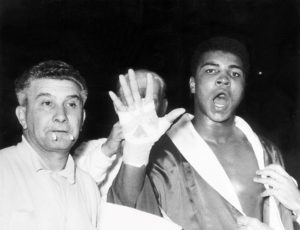 Muhammad Ali predicts that he will in the fifth round before his fight with Henry Cooper at Wembley Stadium in London, June 1963. Action Images / MSI