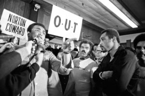 Muhammad Ali and his entourage try to wind up Ken Norton ahead of their third fight in New York, September 1976. Action Images / MSI