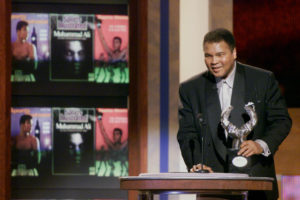 Boxing Legend Muhammad Ali speaks to the audience after accepting the Athlete of the Century award at the Sports Illustrated 20th Century Sports Awards at New York's Madison Square Garden, in this December 2, 1999 file photo. REUTERS/Mike Segar/File Photo