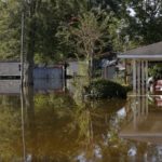 A flood damaged neighborhood is seen in St. Amant