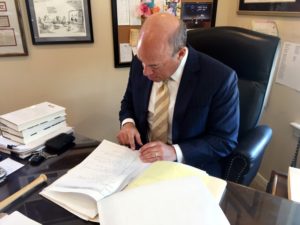Ari Fleischer looks over 9/11 notes during an interview with Reuters in his office in Bedford, New York, U.S. September 7, 2016. Picture taken September 7, 2016. REUTERS/Hussein Waaile