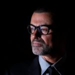 FILE PHOTO British singer George Michael poses for photographers before a news conference at the Royal Opera House in central London