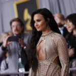 Singer Demi Lovato arrives at the 59th Annual Grammy Awards in Los Angeles
