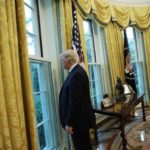 U.S. President Trump looks out window of the Oval Office following an interview with Reuters at the White House in Washington