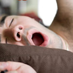 storyblock/Man Yawning In Bed