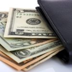 storyblock/Several Dollar Bills Tucked In A Wallet