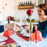 freepik/mature-couple-having-romantic-dinner-home-valentines-day-doing-toast-with-red-wine_153437-1195