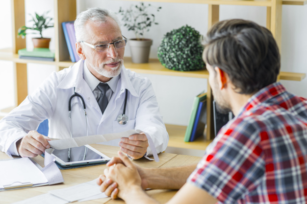 https://www.freepik.com/free-photo/elderly-doctor-listening-young-patient_3019418.htm#page=1&query=man%20talks%20doctor&position=12