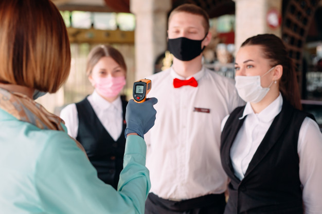 https://www.freepik.com/premium-photo/manager-restaurant-hotel-checks-body-temperature-staff-with-thermal-imaging-device_7975717.htm