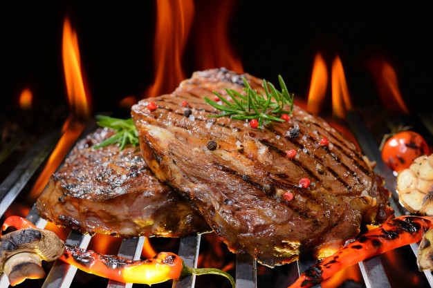 https://www.freepik.com/premium-photo/grilled-beef-steak-with-vegetable-flaming-grill_5383402.htm