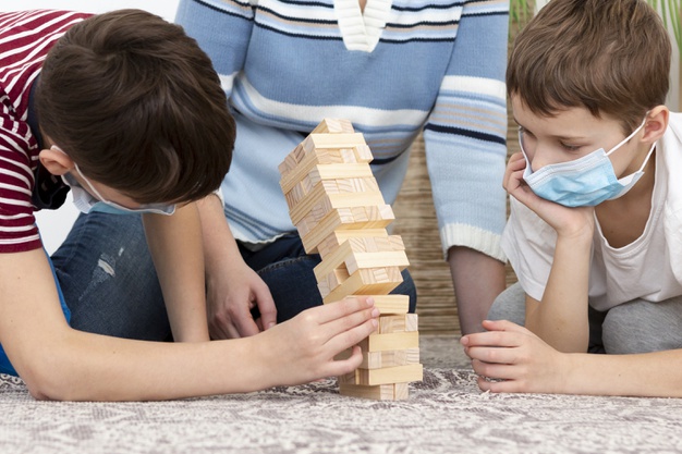 https://www.freepik.com/free-photo/kids-with-medical-masks-playing-jenga-with-mother_7747088.htm
