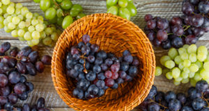 https://www.freepik.com/free-photo/ripe-grapes-wicker-basket-wooden-background-flat-lay_9691623.htm
