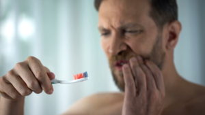 https://www.istockphoto.com/photo/male-in-bathroom-looking-at-blood-toothbrush-oral-hygiene-parodontosis-illness-gm1076954194-288448279