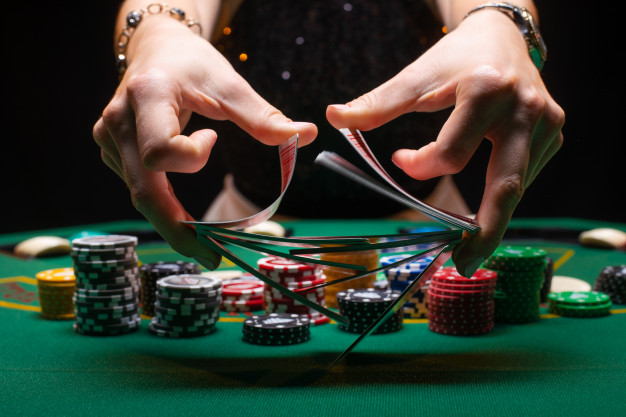 https://www.freepik.com/premium-photo/girl-croupier-shuffles-poker-cards-casino_5718688.htm