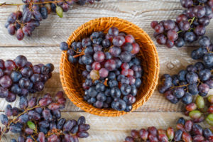 https://www.freepik.com/free-photo/ripe-grapes-wicker-basket-wooden-background-flat-lay_9691626.htm