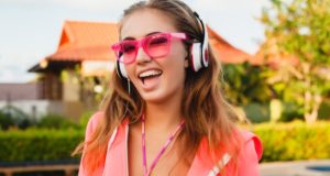 https://www.freepik.com/free-photo/attractive-woman-doing-sports-pool-colorful-pink-hoodie-wearing-sunglasses-listening-music-headphones-summer-vacation-play-tennis-sport-style_10523285.htm#page=4&query=headphones&position=20
