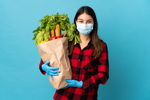 https://www.freepik.com/premium-photo/young-caucasian-with-vegetables-mask-isolated-blue-smiling-lot_9463823.htm#page=1&query=covid%20diet&position=16