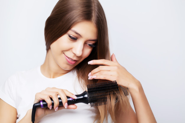 https://www.freepik.com/premium-photo/young-woman-with-luxurious-hair-straightens-it-with-curling-iron_9066326.htm#page=1&query=hair%20straightening%20brush&position=23
