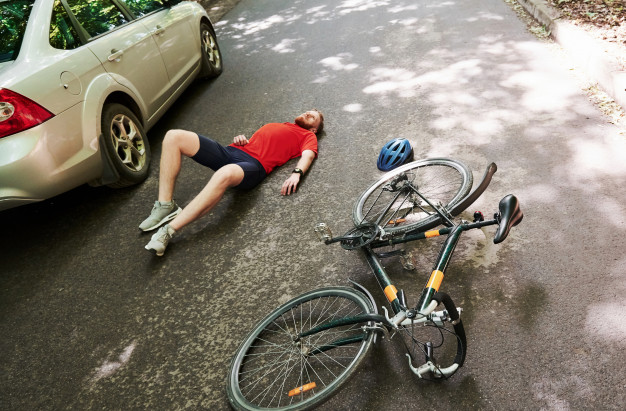 https://www.freepik.com/premium-photo/aerial-view-victim-asphalt-bicycle-silver-colored-car-accident-road-forest-daytime_9832991.htm#page=1&query=bicycle%20accident&position=1