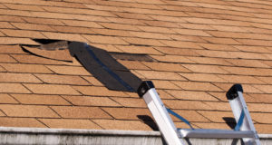 https://www.storyblocks.com/images/stock/fixing-damaged-roof-shingles-a-section-was-blown-off-after-a-storm-with-high-winds-causing-a-potential-leak-bkrxwlrsjiskjlih7