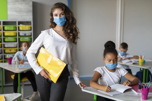 https://www.freepik.com/free-photo/kids-teacher-protecting-themselves-with-medical-masks_10143850.htm#page=1&query=covid%20school&position=44