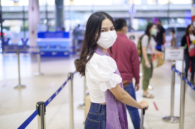 https://www.freepik.com/premium-photo/traveller-woman-is-wearing-protective-mask-international-airport-travel-covid-19-pandemic-safety-travels-social-distancing-protocol_10099047.htm