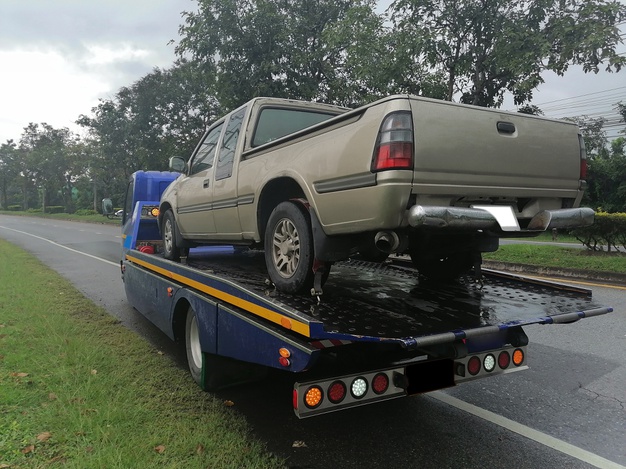 https://www.freepik.com/premium-photo/car-has-broken-down-being-pulled-up-into-tow-truck_10830727.htm