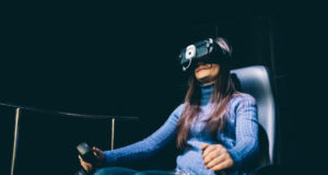 https://www.storyblocks.com/images/stock/young-beautiful-eastern-woman-sitting-on-a-gaming-chair-testing-augmented-reality-with-3d-viewer---games-futuristic-augmented-reality-concept-s6_bpn5yzj2c4awdq
