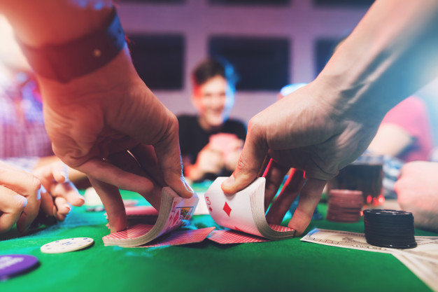 https://www.freepik.com/premium-photo/young-people-play-poker-with-alcohol_5026685.htm#page=2&query=gambling&position=7
