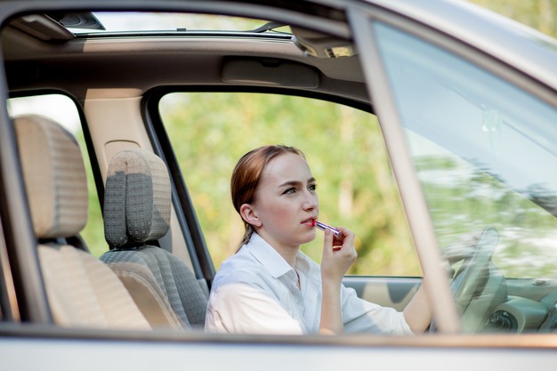 https://www.freepik.com/premium-photo/concept-danger-driving-young-woman-driver-red-haired-teenage-girl-painting-her-lips-doing-applying-make-up-while-driving-car_9927863.htm#page=2&query=teen+driver&position=12