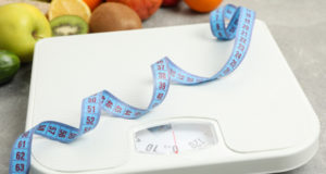 https://www.freepik.com/premium-photo/scales-measuring-tape-vegetarian-food-gray-floor_8996311.htm