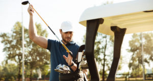 https://www.storyblocks.com/images/stock/handsome-male-golfer-taking-clubs-from-a-bag-in-a-golf-cart-at-the-green-course-rrxauntcbj7qoduh2