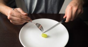 https://www.freepik.com/premium-photo/hands-holding-knife-fork-plate-with-green-grape-white-plate_12602686.htm#page=2&query=disordered+eating&position=8