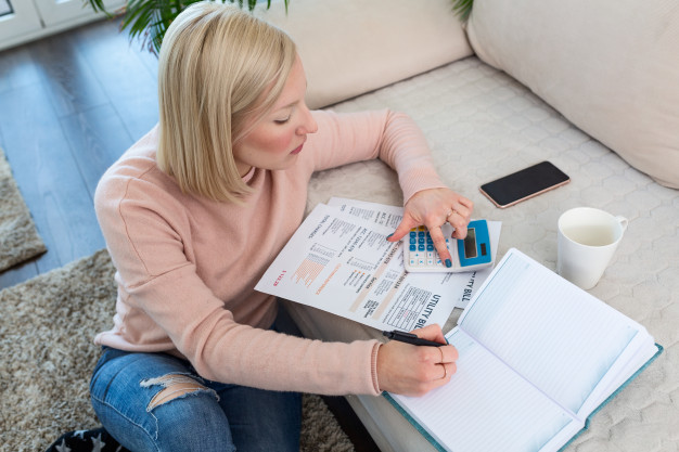 https://www.freepik.com/premium-photo/beautiful-young-albino-woman-sitting-with-calculator-bills-doing-paperwork-hand-woman-doing-finances-calculate-desk-about-cost-home-office-concept-work-from-home_8260784.htm#page=1&query=millennial%20debt&position=5