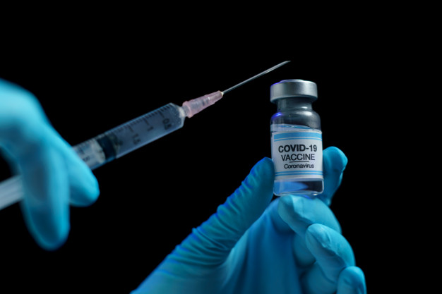 https://www.freepik.com/premium-photo/hand-blue-glove-holding-vaccine-syringe-injection-prevention-immunization-treatment-from-corona-virus-infection_8657553.htm#page=2&query=covid+vaccines&position=19