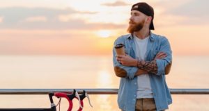 https://www.freepik.com/free-photo/handsome-bearded-man-traveling-with-bicycle-morning-sunrise-by-sea-drinking-coffee-healthy-active-lifestyle-traveler_10885256.htm#page=5&query=person+drinking+coffee&position=23