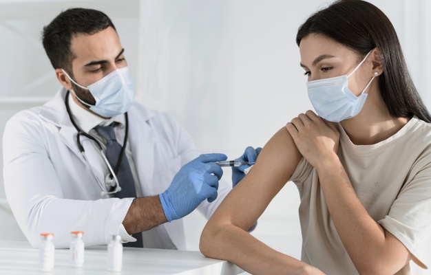 https://www.freepik.com/premium-photo/young-woman-being-vaccinated-by-doctor_11156679.htm