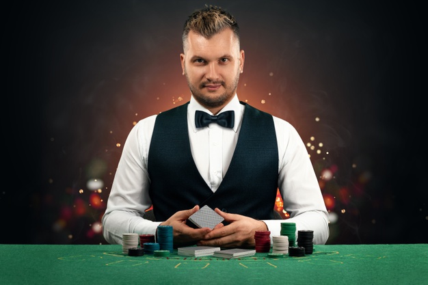 https://www.freepik.com/premium-photo/croupier-man-sits-table-with-chips-playing-cards_11478089.htm