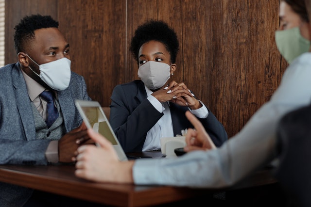 https://www.pexels.com/photo/business-people-wearing-face-masks-and-talking-4427957/