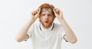 https://www.freepik.com/free-photo/confused-bearded-redhead-guy-posing-against-white-wall-with-glasses_11104179.htm#page=1&query=squinting&position=33