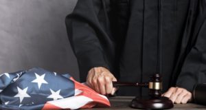 https://www.freepik.com/free-photo/close-up-judge-with-flag-striking-gavel_5236737.htm#page=1&query=judge&position=0