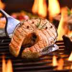 grilled-salmon-fish-with-various-vegetables-flaming-grill_126277-3