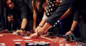 https://www.freepik.com/premium-photo/people-elegant-clothes-standing-playing-poker-casino-together_6657934.htm#page=1&query=gambling&position=12