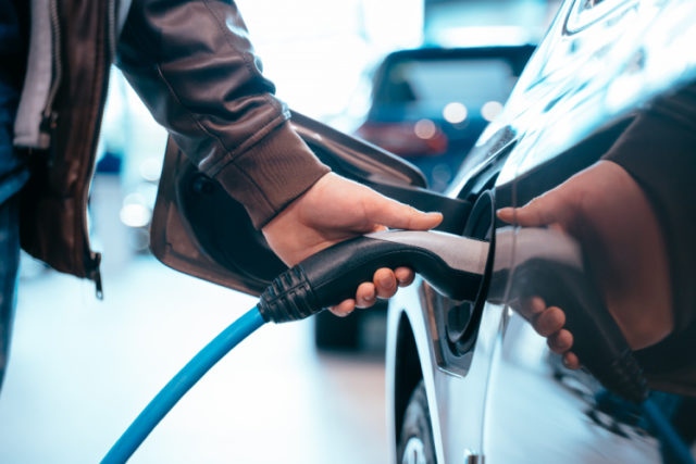 https://www.freepik.com/free-photo/human-hand-is-holding-electric-car-charging-connect-electric-car_8069535.htm#page=1&query=electric%20vehicles&position=11