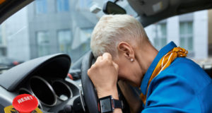two pik from Freepik/https://www.freepik.com/free-photo/side-view-unhappy-stressed-middle-aged-woman-squeezing-fists-resting-head-steering-wheel-stuck-traffic-jam-being-late-work-get-into-car-accident-sitting-driver-s-seat_11102054.htm?query=tired%20driver