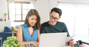 https://www.freepik.com/free-photo/serious-asian-husband-checking-analyzing-statement-utilities-bills-sitting-together-home_14057571.htm#page=1&query=couple%20finances&position=2
