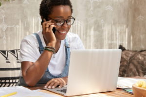 https://www.freepik.com/free-photo/stylish-african-american-woman-calls-smart-phone-looks-laptop-computer-updates-software_13760565.htm#page=1&query=person%20on%20device&position=4